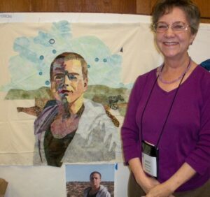 Woman next to painting of boy
