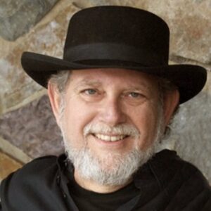 Bearded man in black shirt and hat